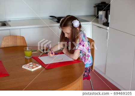 7 years old girl draws with watercolors. Close-up. 7 years old girl draws with watercolors. Close-up. 69469105