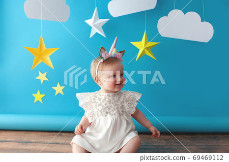 First baby birthday. Girl touches a star. First baby birthday. Girl touches a star. 69469112