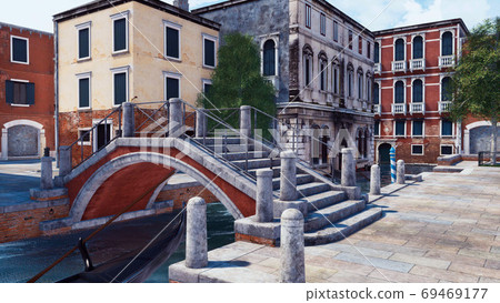 Empty Venice street with old bridge over canal 69469177