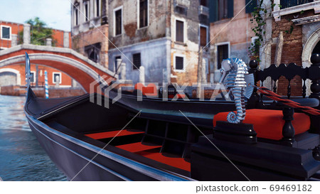 Close-up of empty venetian gondola on Venice canal 69469182
