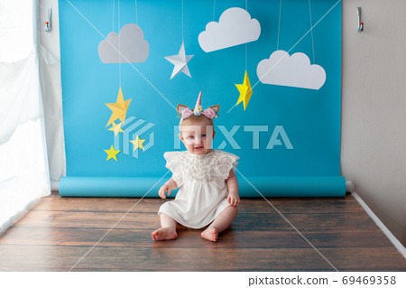 First baby birthday. Girl touches a star. First baby birthday. Girl touches a star. 69469358
