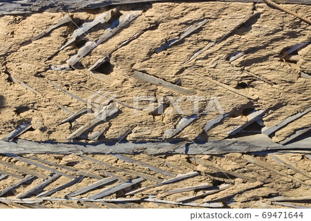 Texture of a clay wall of an old house. Background Texture of a clay wall of an old house. Background 69471644