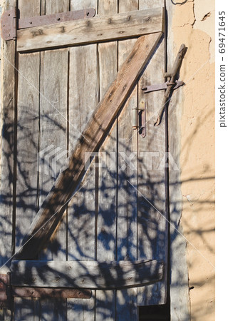 Door from old boards, close up. Door from old boards, close up. 69471645