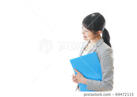 A smiling business woman in a suit A smiling business woman in a suit 69472115