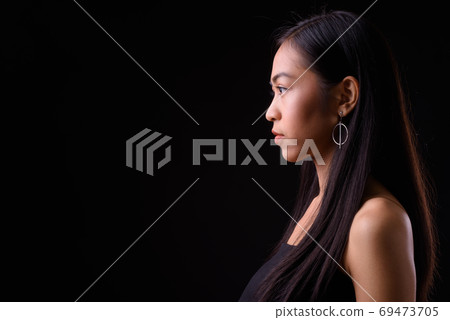 Closeup profile view of young beautiful Asian woman 69473705