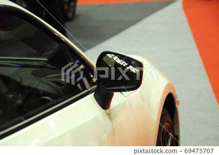 KUALA LUMPUR, MALAYSIA -NOVEMBER 12, 2017: Car side mirror or door mirror build at extrior of car for the purposes of helping the driver see areas behind and to the sides of the vehicle.   69473707