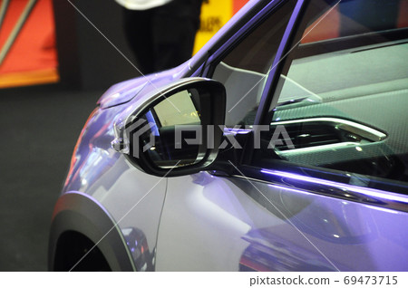 KUALA LUMPUR, MALAYSIA -NOVEMBER 12, 2017: Car side mirror or door mirror build at extrior of car for the purposes of helping the driver see areas behind and to the sides of the vehicle.   69473715