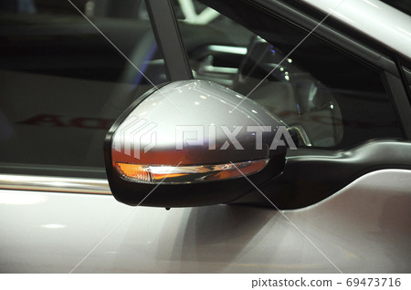 KUALA LUMPUR, MALAYSIA -NOVEMBER 12, 2017: Car side mirror or door mirror build at extrior of car for the purposes of helping the driver see areas behind and to the sides of the vehicle.   69473716