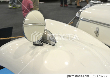 KUALA LUMPUR, MALAYSIA -NOVEMBER 12, 2017: Car side mirror or door mirror build at extrior of car for the purposes of helping the driver see areas behind and to the sides of the vehicle.   69473727