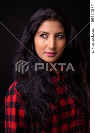 Face of young beautiful Indian hipster woman thinking Face of young beautiful Indian hipster woman thinking 69473877