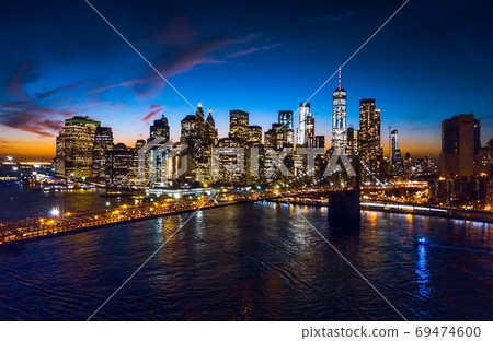 Aerial view of Brooklyn bridge and skyline at night 69474600
