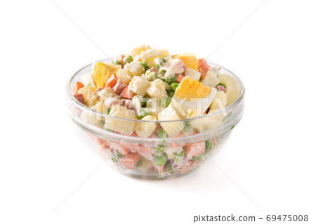 Traditional Russian salad in bowl. Olivier salad isolated on white background Traditional Russian salad in bowl. Olivier salad isolated on white background 69475008