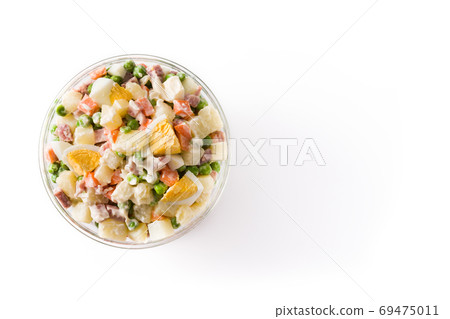 Traditional Russian salad in bowl. Olivier salad isolated on white background with copy space Traditional Russian salad in bowl. Olivier salad isolated on white background with copy space 69475011