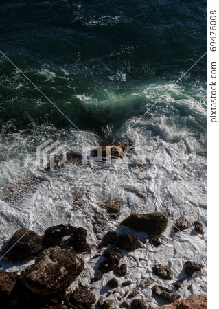 Ocean wave background breaking sea water rocky shore Ocean wave background breaking sea water rocky shore 69476008