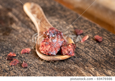 Croton lechleri, or sangre de drago resin on a spoon 69476986