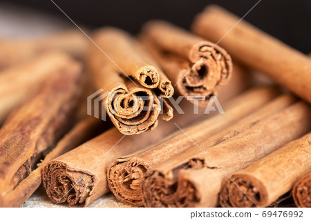 Close up of Ceylon cinnamon sticks Close up of Ceylon cinnamon sticks 69476992