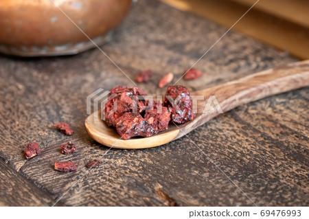 Croton lechleri, or sangre de drago resin on a table Croton lechleri, or sangre de drago resin on a table 69476993