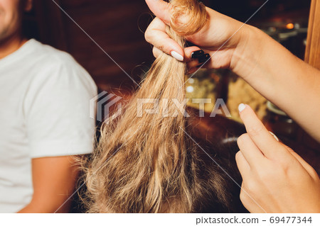 Combing with brush and pulls long hair. Daily preparation for looking nice, Long Disheveled Hair,Holding Messy Unbrushed Dry Hair In Hands. Hair Damage, Health And Beauty Concept. Combing with brush and pulls long hair. Daily preparation for looking nice, Long Disheveled Hair,Holding Messy Unbrushed Dry Hair In Hands. Hair Damage, Health And Beauty Concept. 69477344