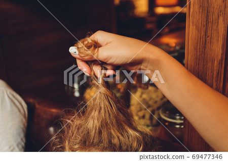 Combing with brush and pulls long hair. Daily preparation for looking nice, Long Disheveled Hair,Holding Messy Unbrushed Dry Hair In Hands. Hair Damage, Health And Beauty Concept. Combing with brush and pulls long hair. Daily preparation for looking nice, Long Disheveled Hair,Holding Messy Unbrushed Dry Hair In Hands. Hair Damage, Health And Beauty Concept. 69477346