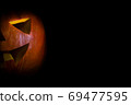 Halloween jack lantern Pumpkin On A Black Background with copyspace 69477595