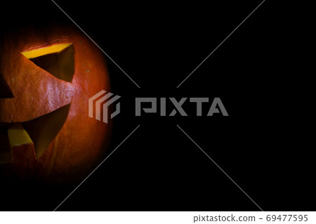Halloween jack lantern Pumpkin On A Black Background with copyspace Halloween jack lantern Pumpkin On A Black Background with copyspace 69477595