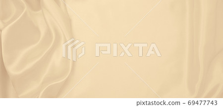 Smooth elegant golden silk or satin luxury cloth texture as wedd Smooth elegant golden silk or satin luxury cloth texture as wedd 69477743