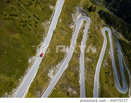 Aerial top view on scenic curvy mountain pass road to the Timmelsjoch at the border of Italy and Austria in the Alps 69478337