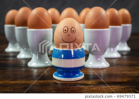 Happy Different Individual Concept Eggs in Egg Cups Happy Different Individual Concept Eggs in Egg Cups 69479371