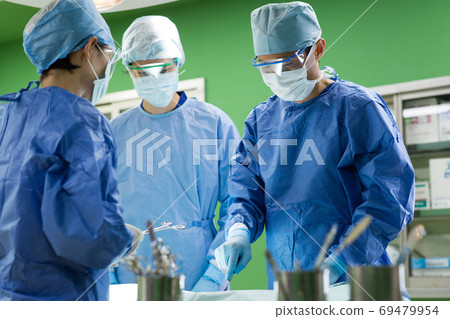 Medical staff performing surgery Medical staff performing surgery 69479954