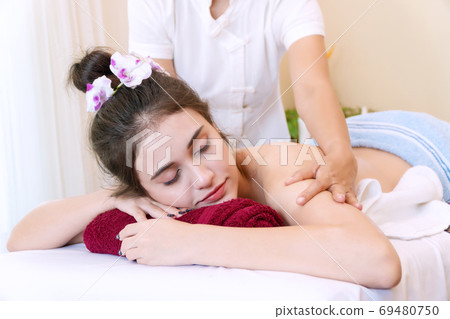 Close up of young woman wear towel relaxation for body and head Close up of young woman wear towel relaxation for body and head 69480750
