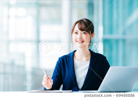 Business female desk work 69480886