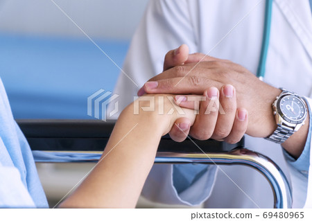 Patient cheering and support. Hand of friendly man doctor holdin 69480965