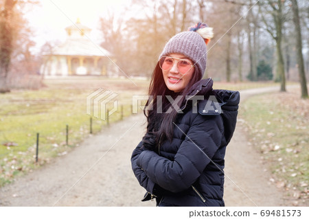 Young female tourist in Sans Souci palace in Potsdam, Berlin, Ge Young female tourist in Sans Souci palace in Potsdam, Berlin, Ge 69481573