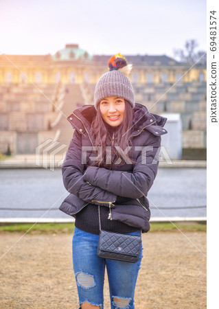 Young female tourist in Sans Souci palace in Potsdam, Berlin, Ge Young female tourist in Sans Souci palace in Potsdam, Berlin, Ge 69481574