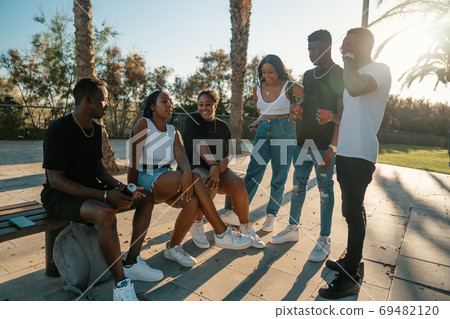 Group of young modern african black friends happily sitting together 69482120