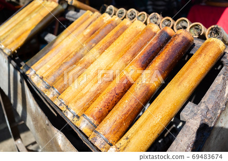 rice cooked in bamboo tubes rice cooked in bamboo tubes 69483674