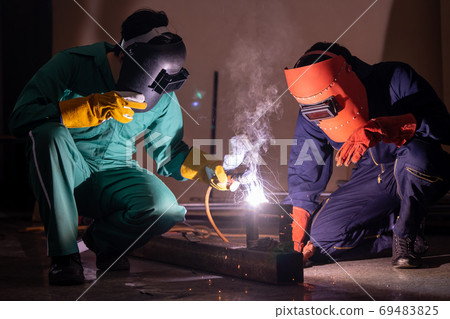 Metal welding steel works using electric arc welding machine Metal welding steel works using electric arc welding machine 69483825
