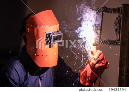 Metal welding steel works using electric arc welding machine 69483894