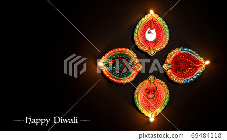 Happy Diwali concept, Clay Diya lamps lit during Dipavali, Hindu 69484118