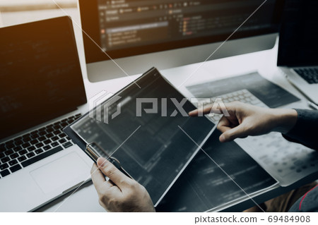 Asian man working code program developer computer web developmen Asian man working code program developer computer web developmen 69484908