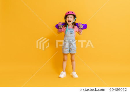 Cute child with skateboard Cute child with skateboard 69486032