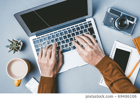 Male hand working on a personal computer Male hand working on a personal computer 69486106
