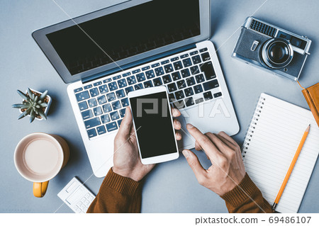 Male hand working on a personal computer 69486107