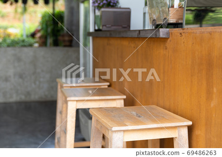 Old wood chair in coffee cafe shop. Old wood chair in coffee cafe shop. 69486263