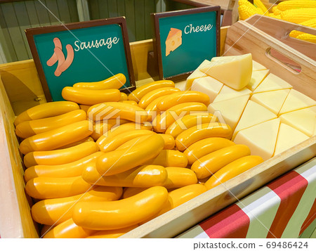 Artificial sausage and cheese. 69486424