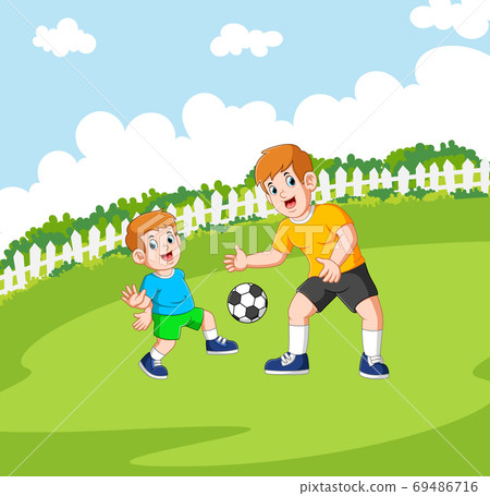 Two boys are playing the football Two boys are playing the football 69486716