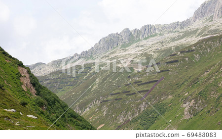 Snow and rock fence in high mountains Snow and rock fence in high mountains 69488083