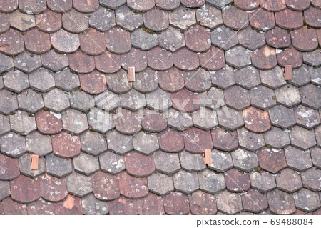 Old roof with odd rooftiles Old roof with odd rooftiles 69488084