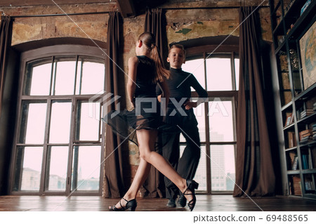Young couple boy and girl dancing ballroom dance Rumba Young couple boy and girl dancing ballroom dance Rumba 69488565