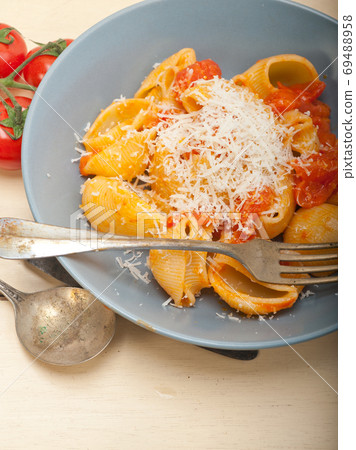 Italian snail lumaconi pasta with tomatoes Italian snail lumaconi pasta with tomatoes 69488958